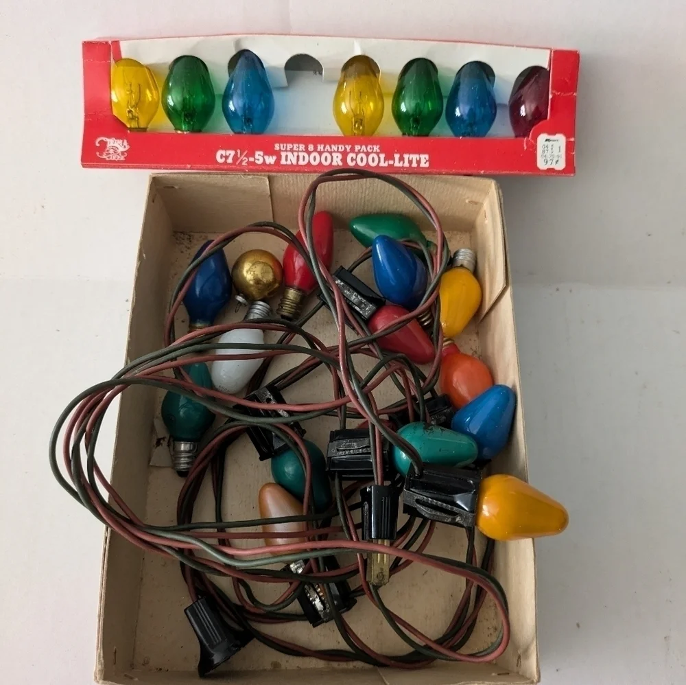 Vintage Christmas lights Multicolor and extra bulbs.